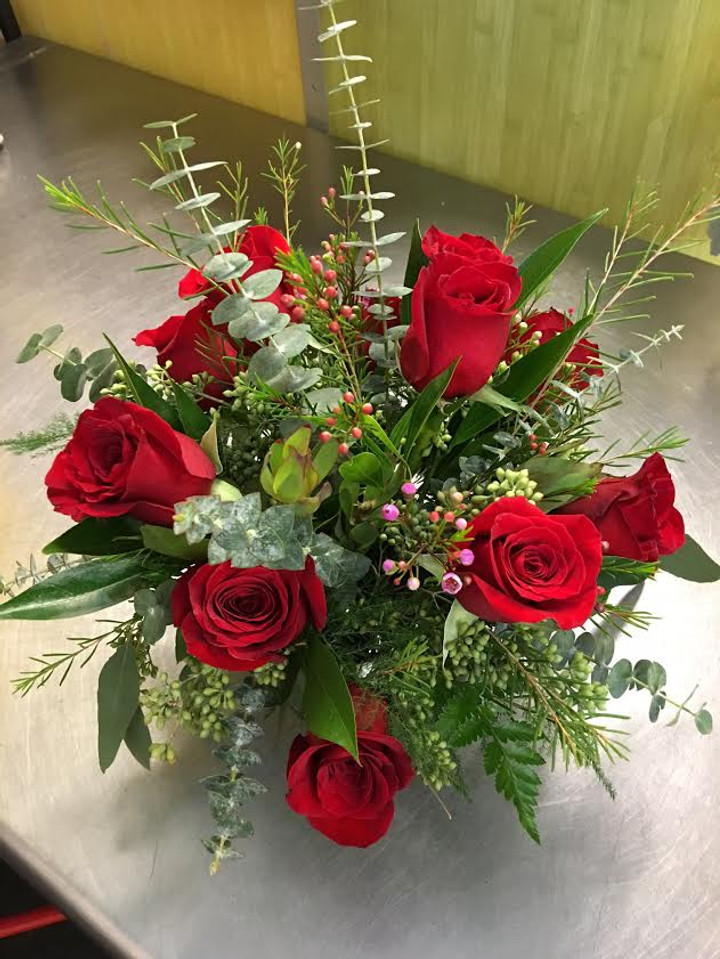One dozen premium roses in a clear glass cube  